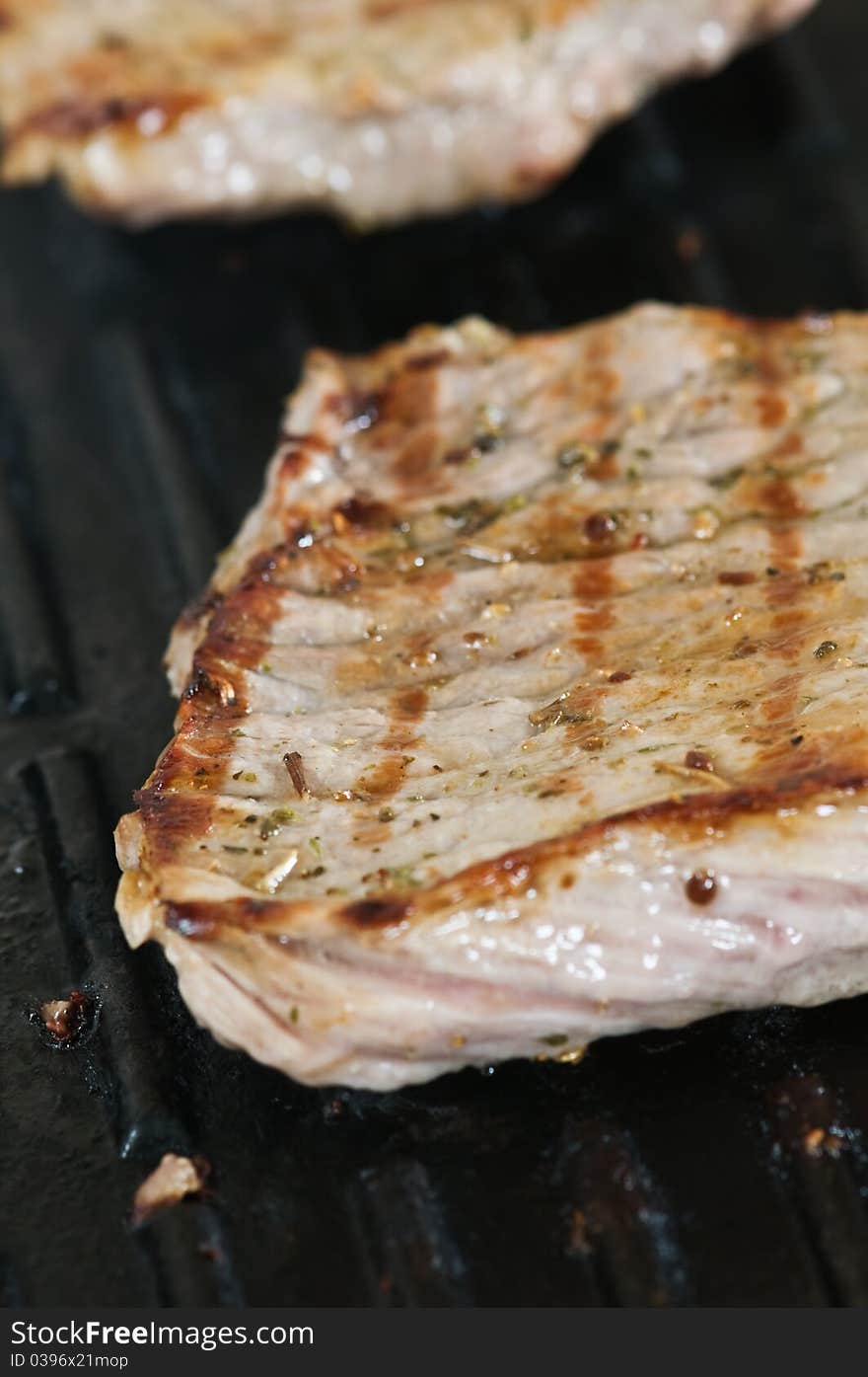 Striped steak on grill closeup