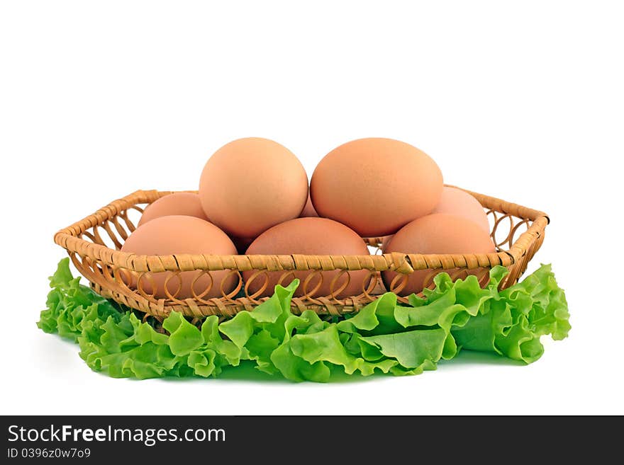 Eggs in a basket a over white background