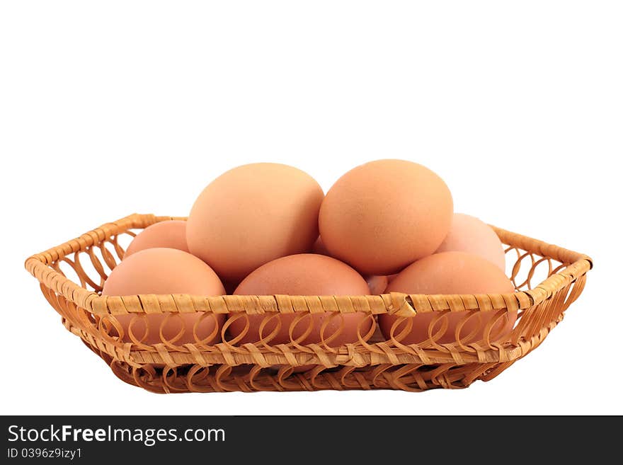 Eggs in a basket a over white background