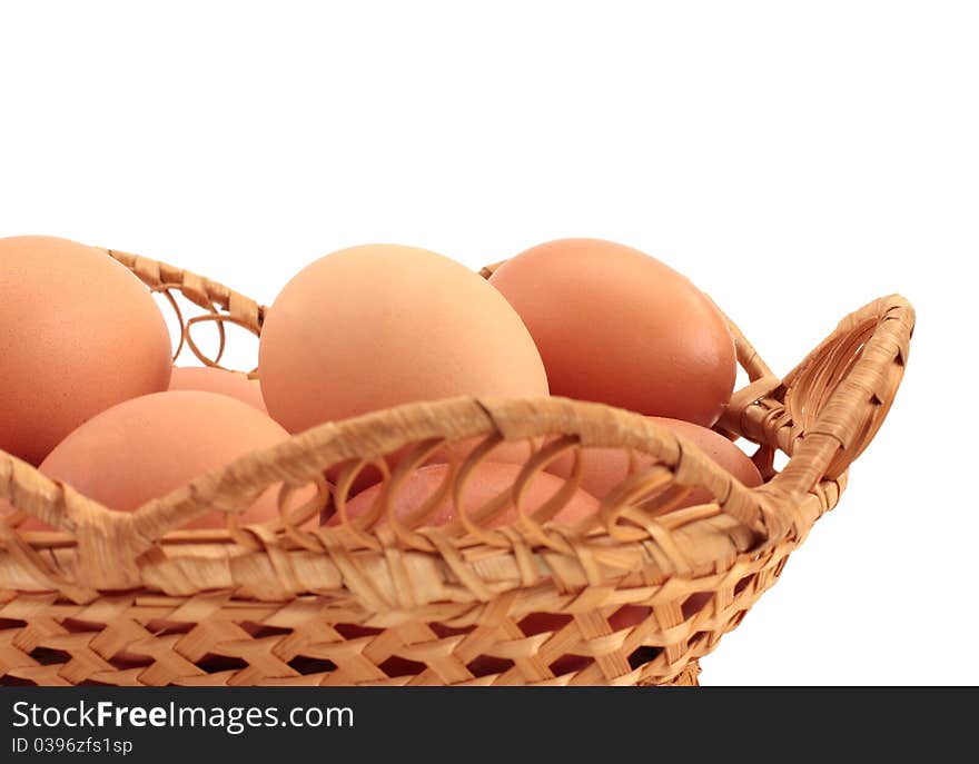 Eggs in a basket a over white background