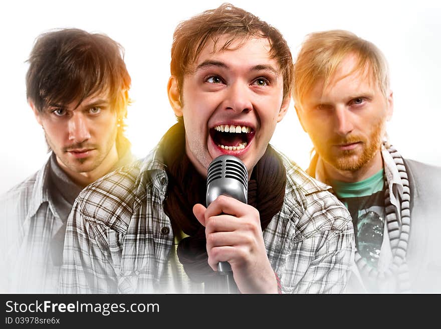 Portrait of three handsome musicians over white background