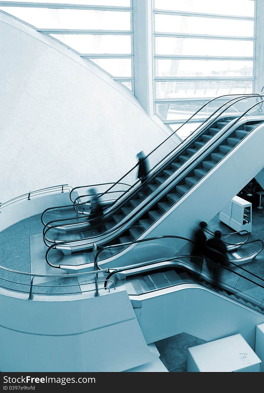 Architectural detail of escalator and people. Architectural detail of escalator and people