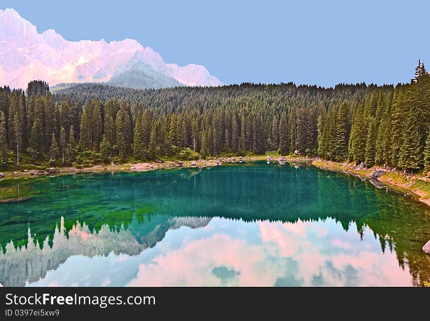 Perfectly clear emerald lake in Dolomites