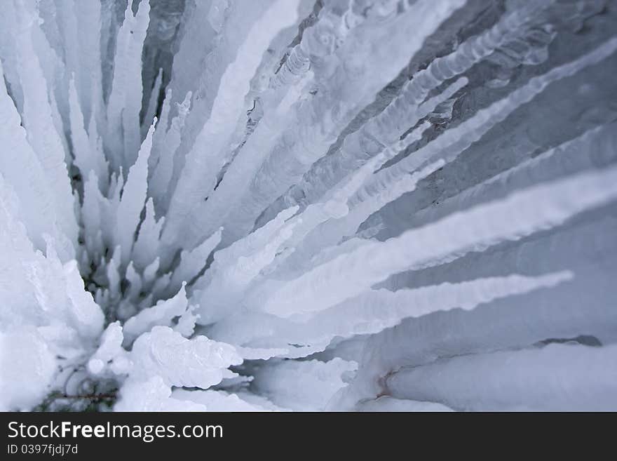 Close view of blue icicles background in cold light