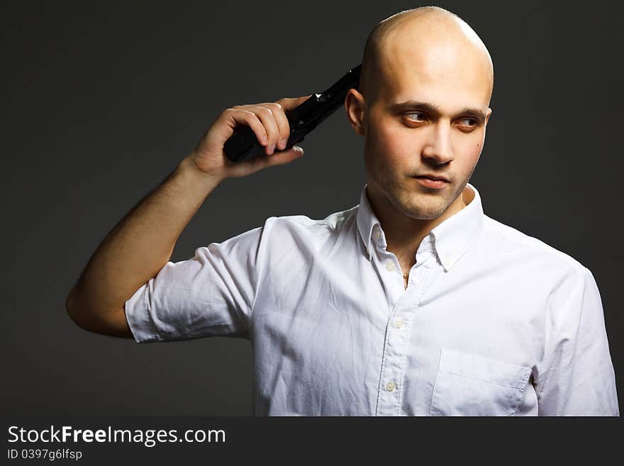 Handsome young man holding a gun