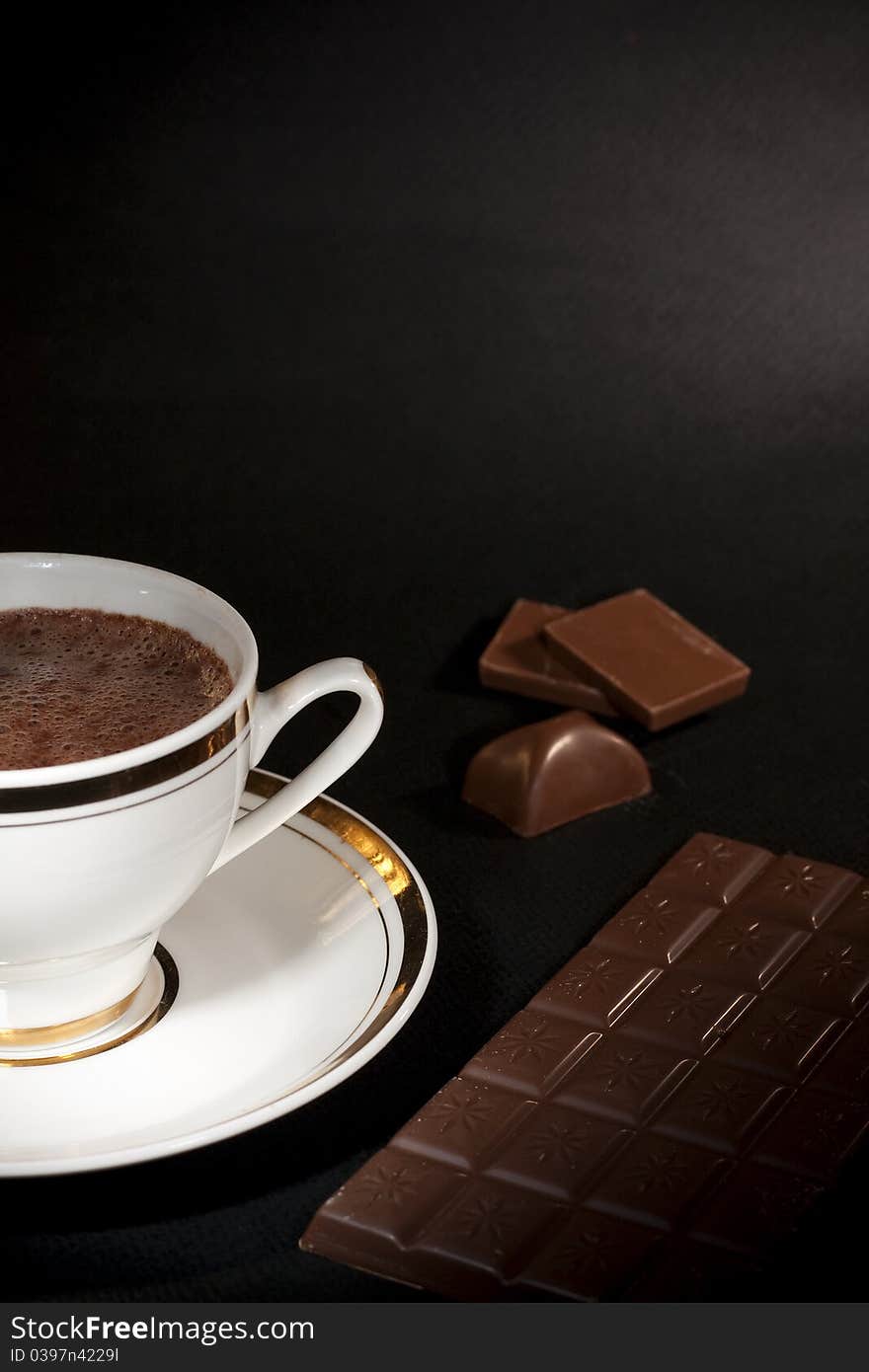 Art, luxury chocolate hot drink and milk chocolate bars on black background