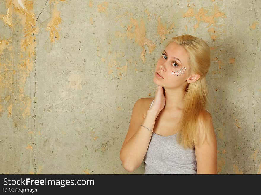 Beautiful woman with makeup and sequins