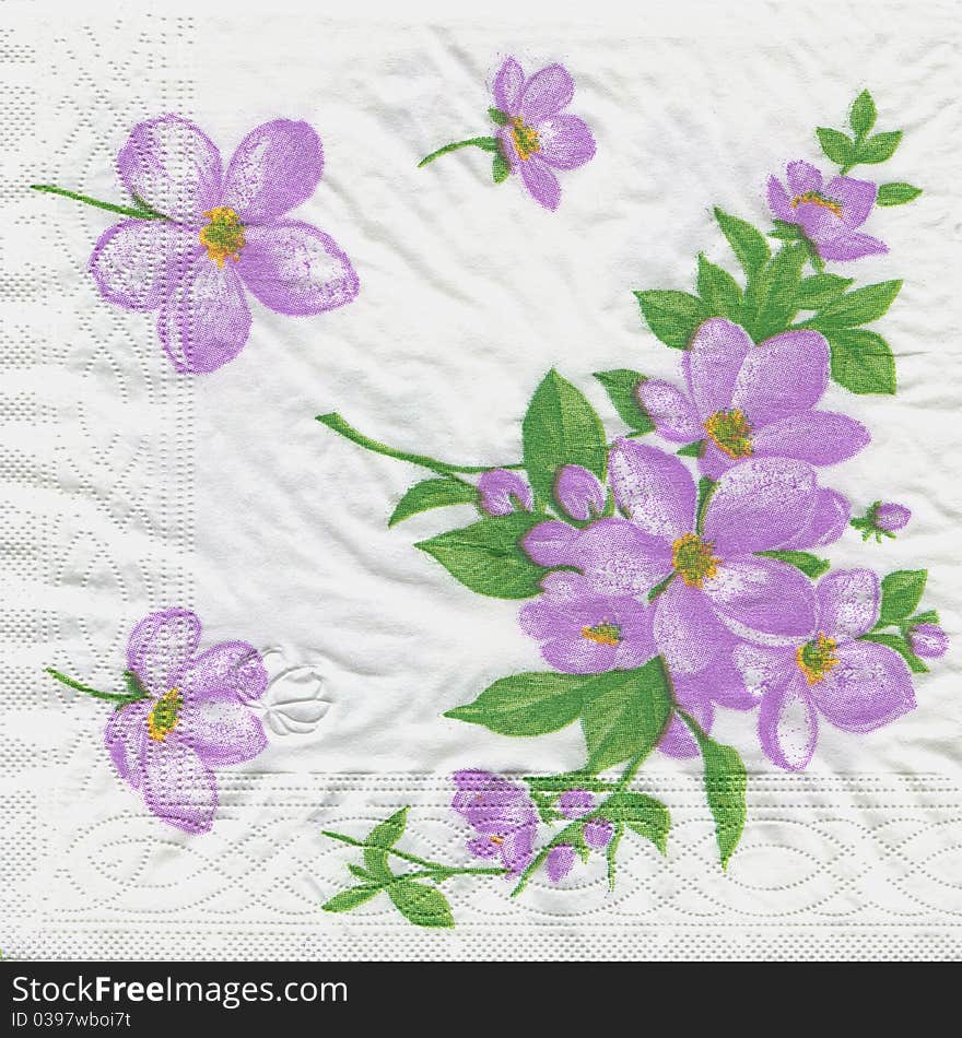 A close up of a purple flowering paper napkin