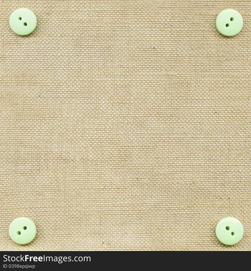 Buttons on fabric as background