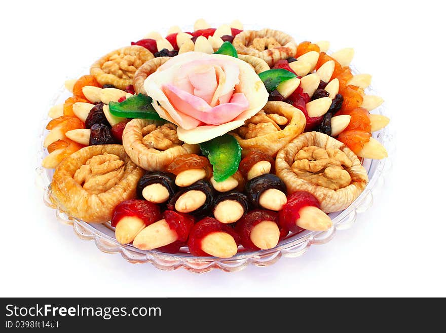 Dried fruits in plate isolated on white background.