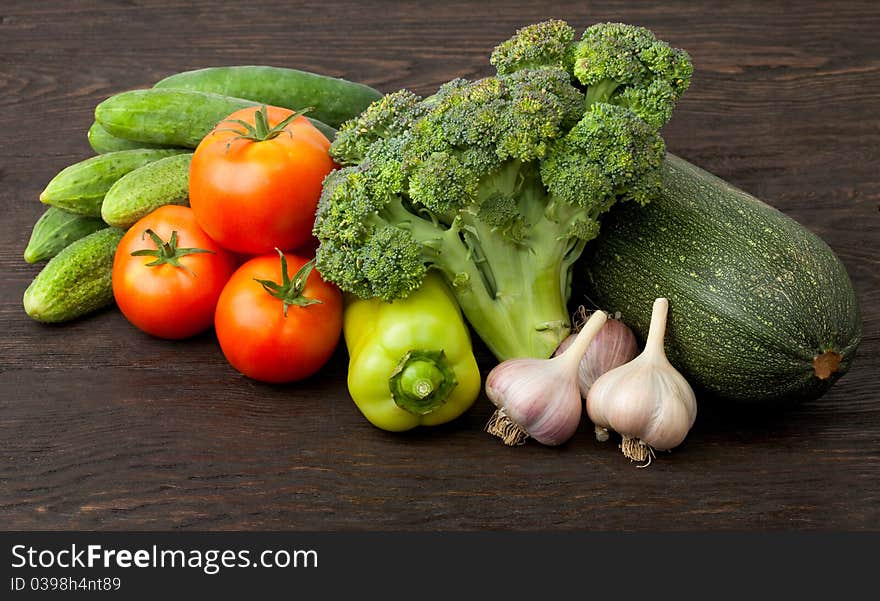 Fresh vegetables: tomatoes, cucumbers, broccoli, zucchini and garlic