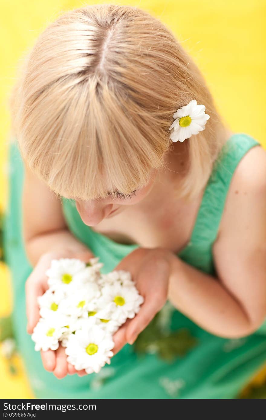 Nice Girl Sitting With Flowers