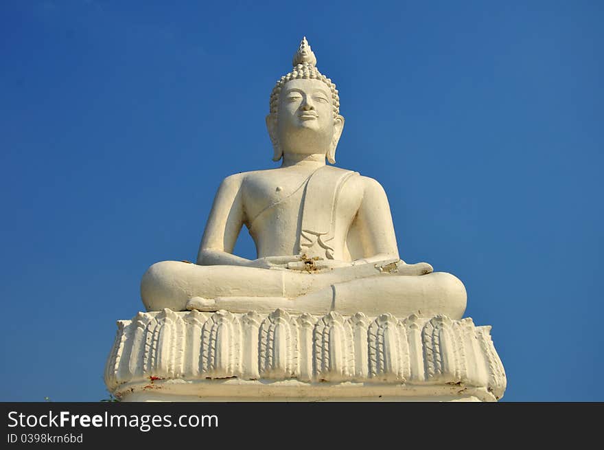 Buddha statue on blue background. Buddha statue on blue background