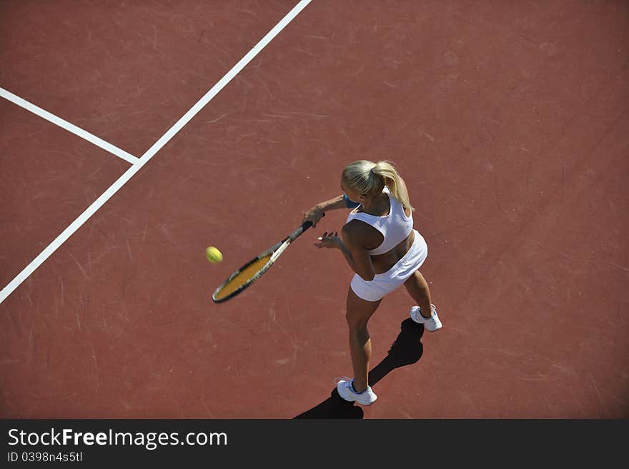 Young Woman Play Tennis Outdoor