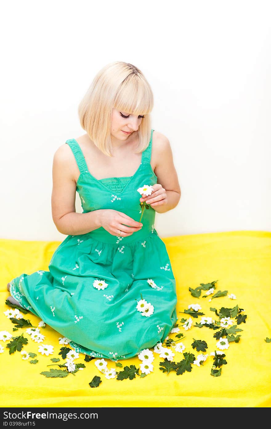 Pretty Young Adult Sitting With Flowers