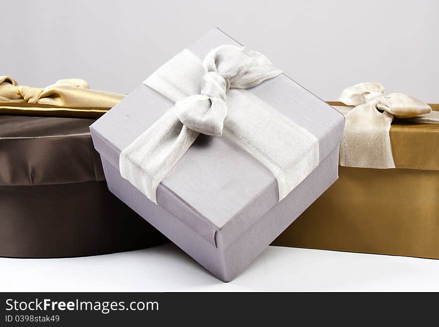 Gold, brown and silver gift boxes. Gold, brown and silver gift boxes