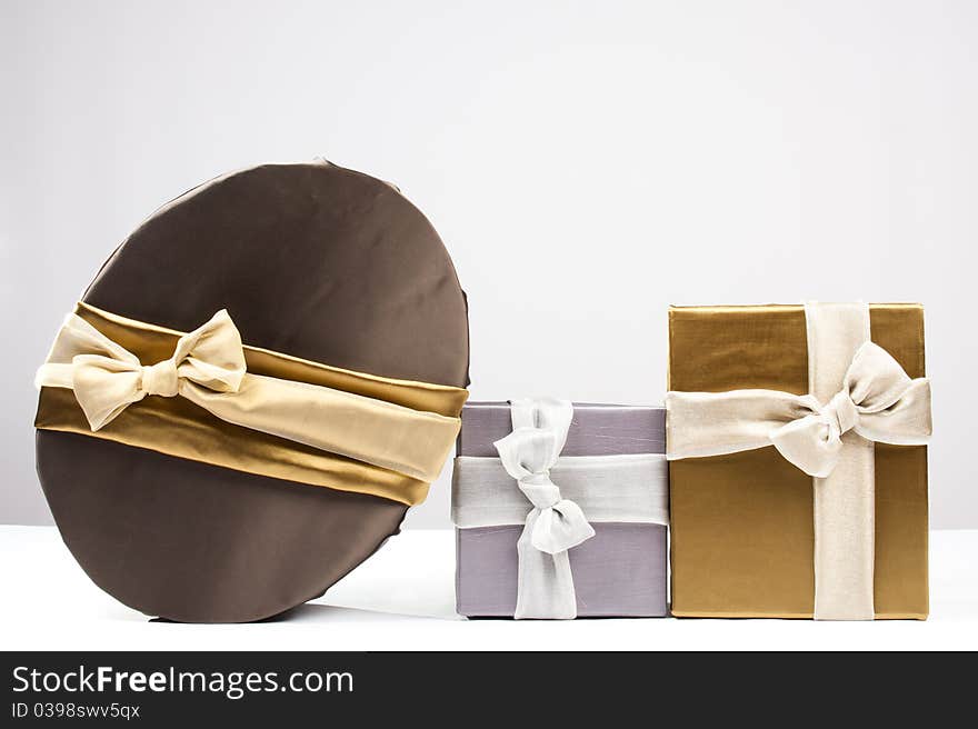 Gold, brown and silver gift boxes. Gold, brown and silver gift boxes