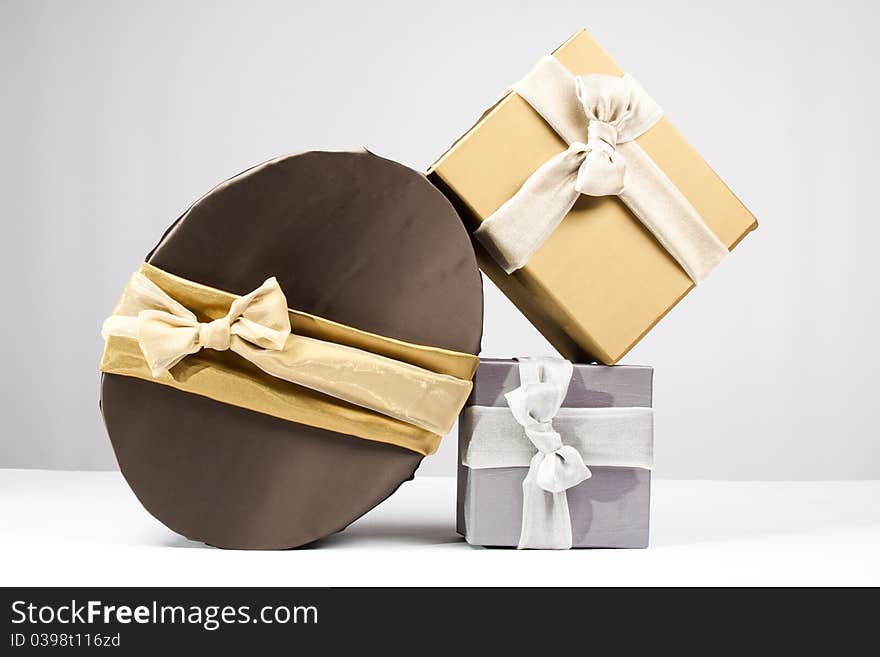 Gold, brown and silver gift boxes. Gold, brown and silver gift boxes