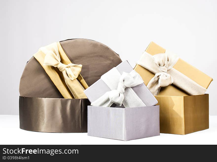 Gold, brown and silver gift boxes. Gold, brown and silver gift boxes