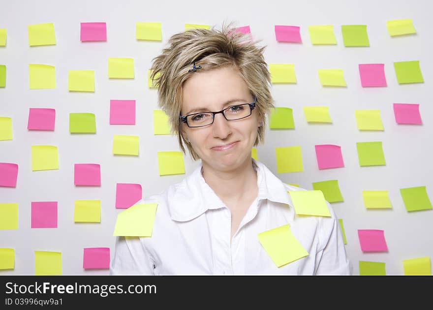 Portrait of business woman with note papers