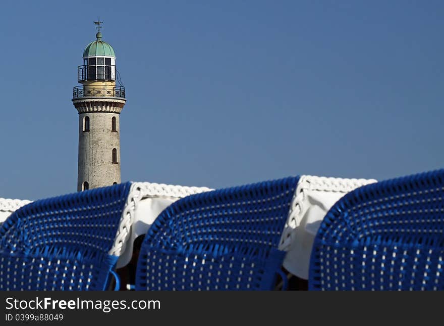 Beach chairs with light tower and copy space