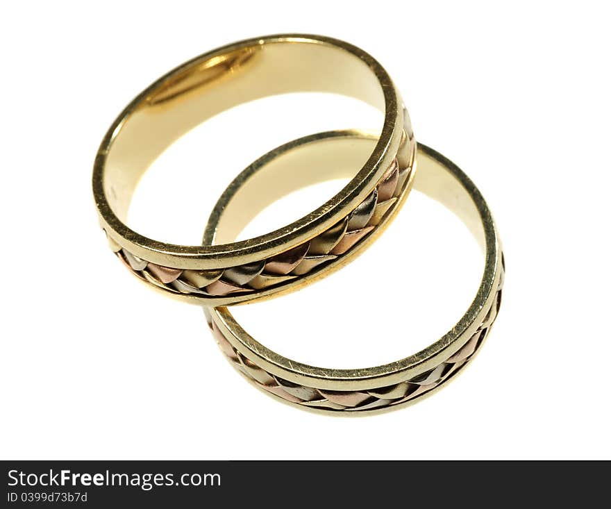 Gold wedding rings on a white background