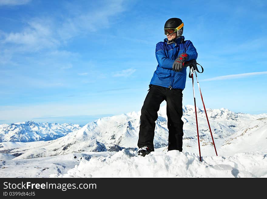 Lone man enjoying the view over the beautiful landscape of winter mountains. Alps
