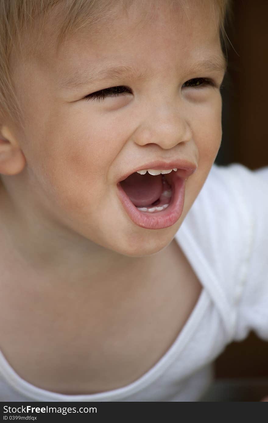 Portrait of screaming boy outside. Portrait of screaming boy outside