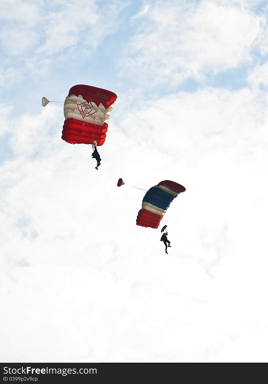 Parachute from the plane to the ground.