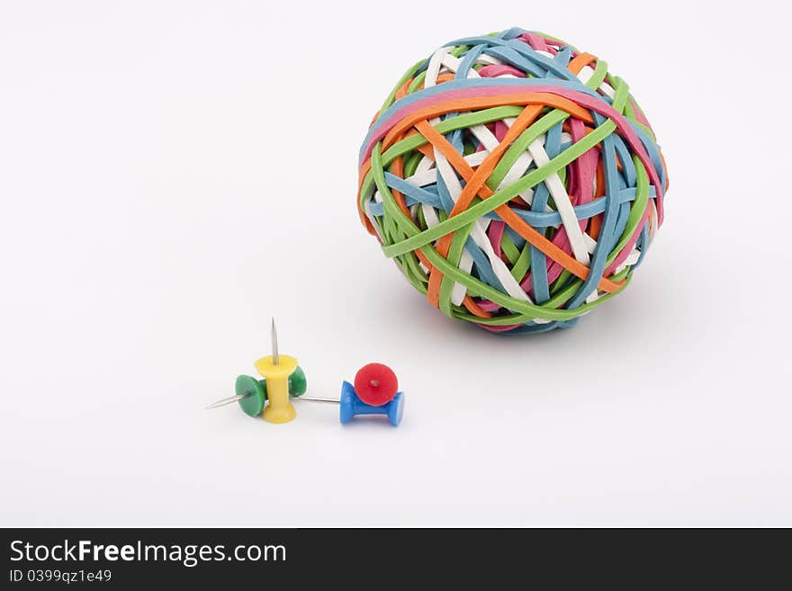 Rubber rings of different colors assembled for easy storage in a bowl with the office pins. Rubber rings of different colors assembled for easy storage in a bowl with the office pins.