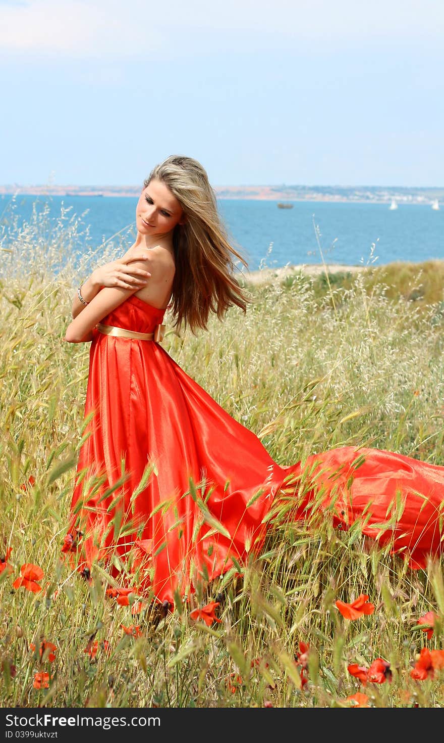 Attractive young woman in red dress