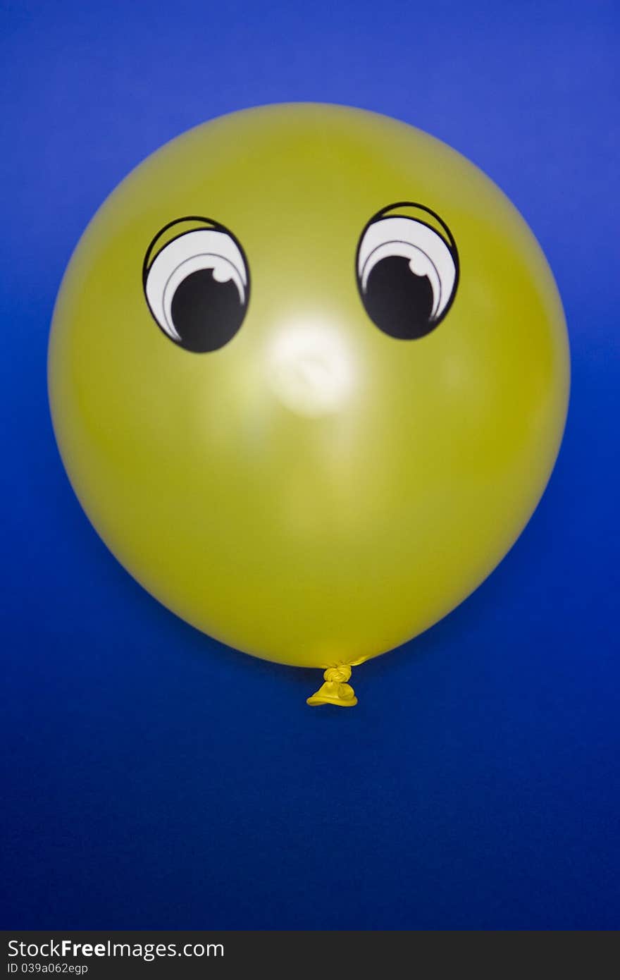 This is a balloon with a face. This is a balloon with a face