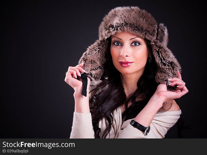 Attractive girl in warm winter fur hat