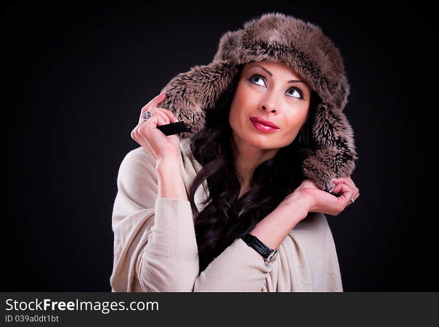 Attractive girl in warm winter fur hat