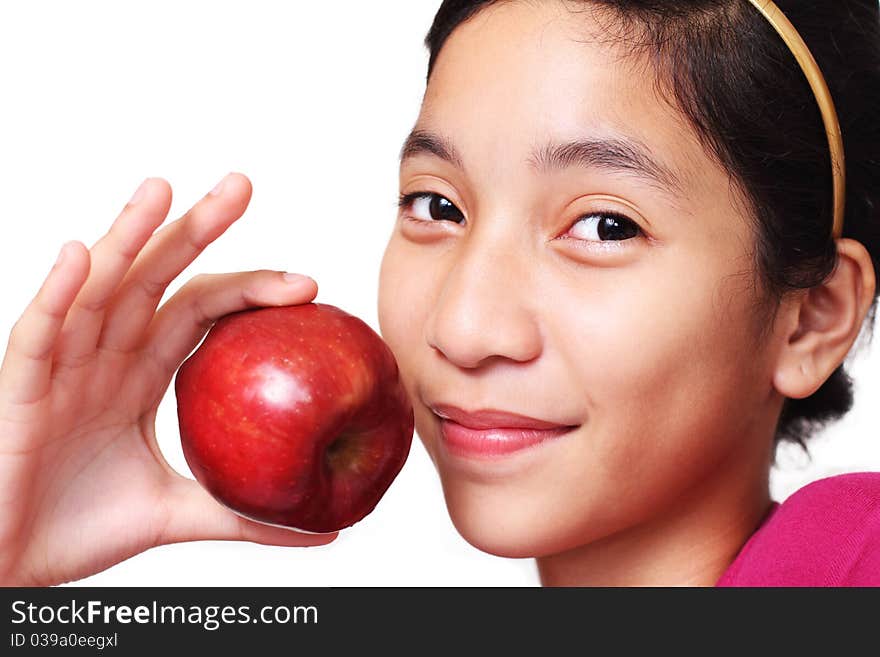 Young asian girl showing an apple. Young asian girl showing an apple