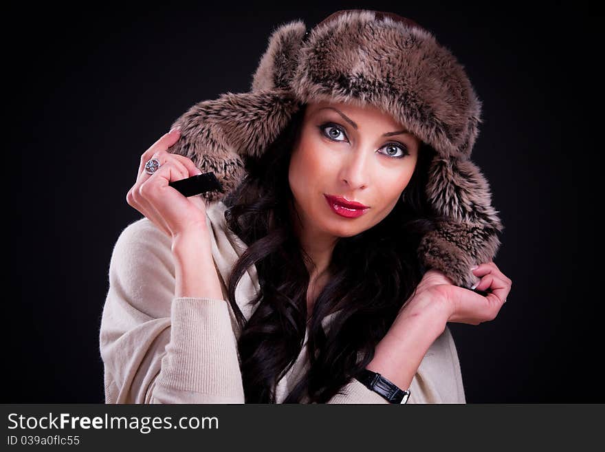 Attractive girl in warm winter fur hat