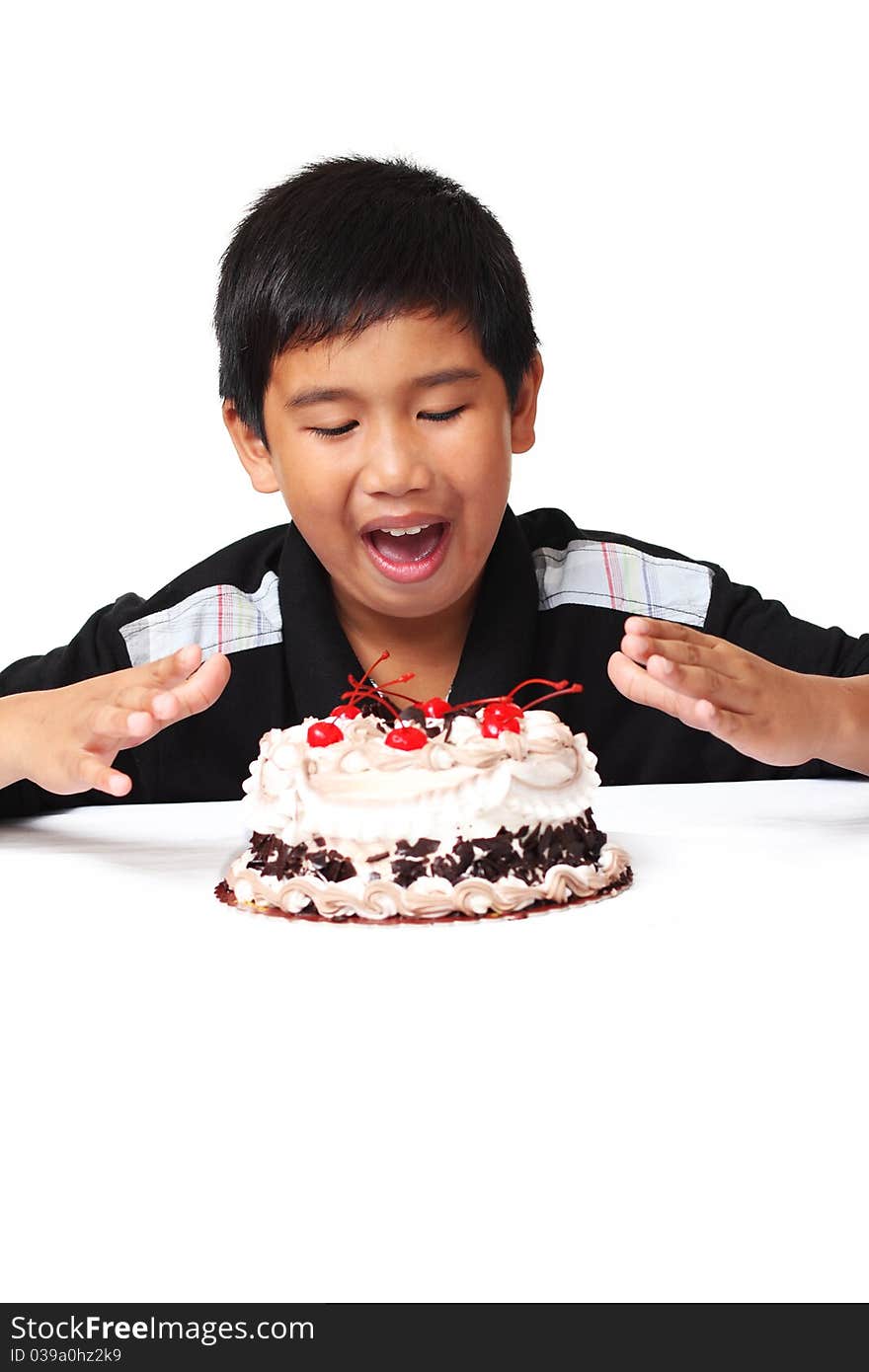 Happy asian boy with delicious cake. Happy asian boy with delicious cake