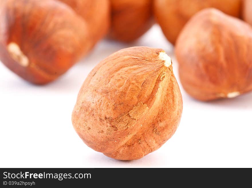 Shelled hazelnuts isolated on white background