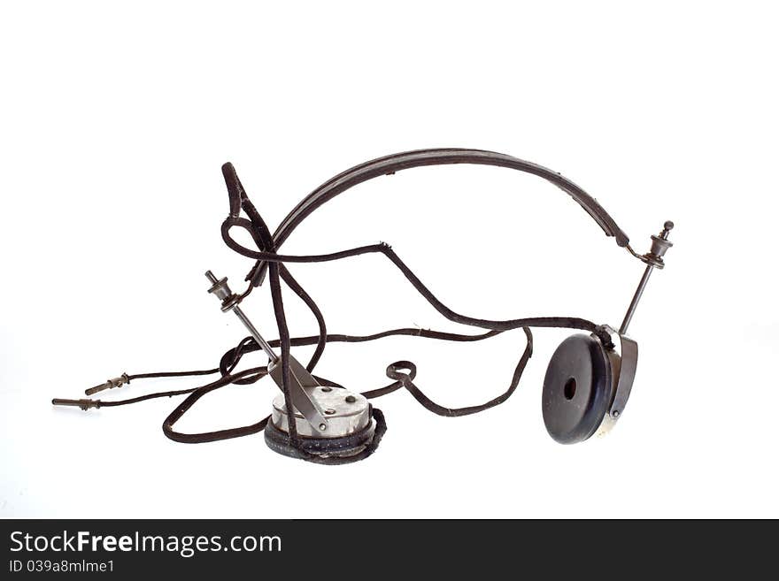 Old historic headphone on white background. Old historic headphone on white background