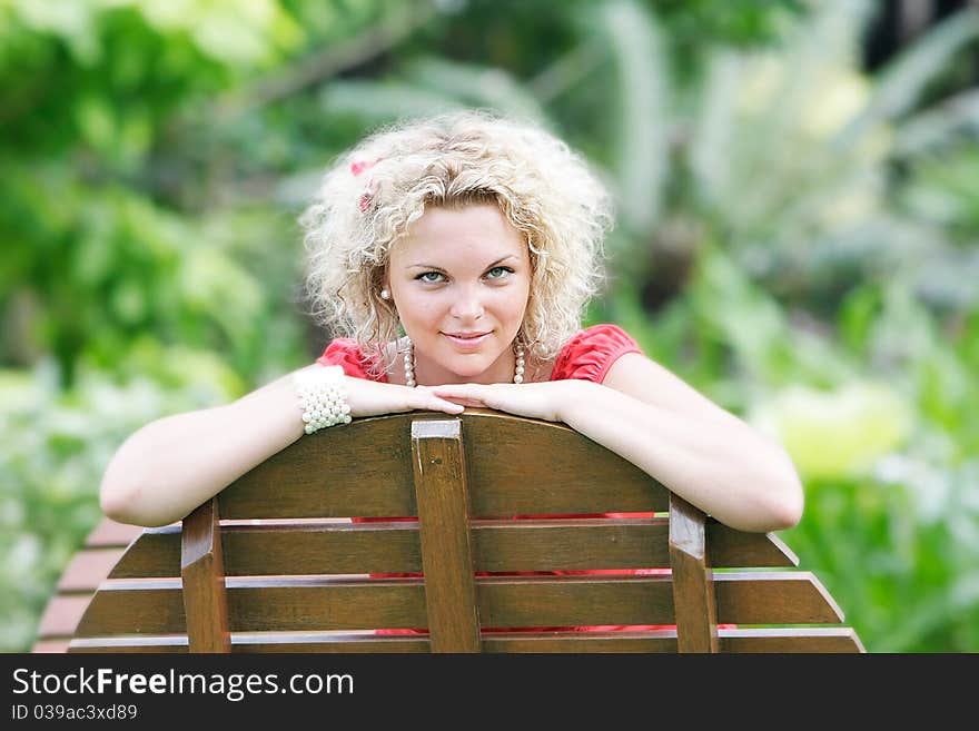 Young beautiful woman resting on natural background