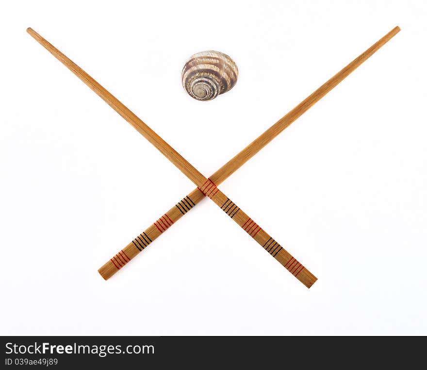 Chopsticks and snail isolated on white background