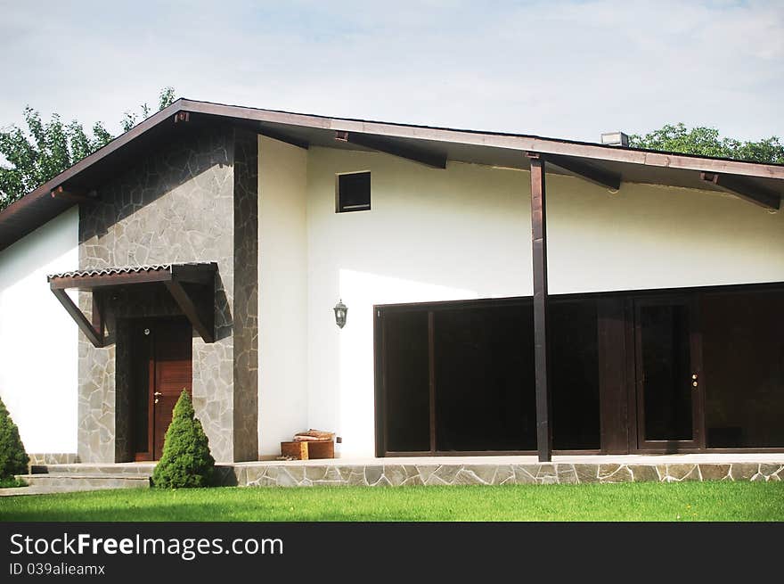 New family house with white façade and terrace. New family house with white façade and terrace.