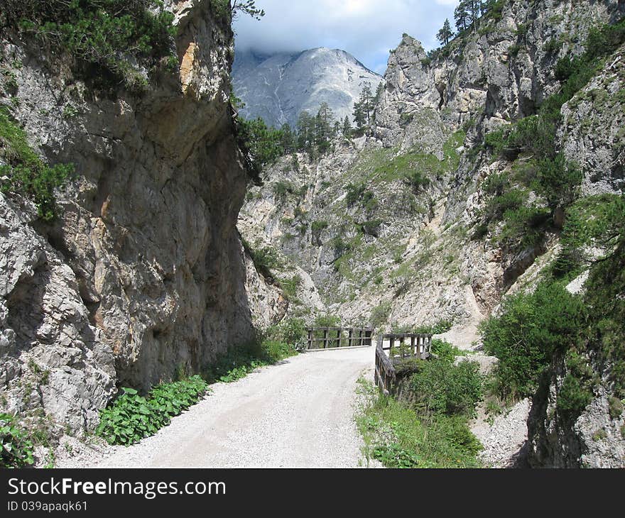 Small street through a valley in the mountains. Small street through a valley in the mountains