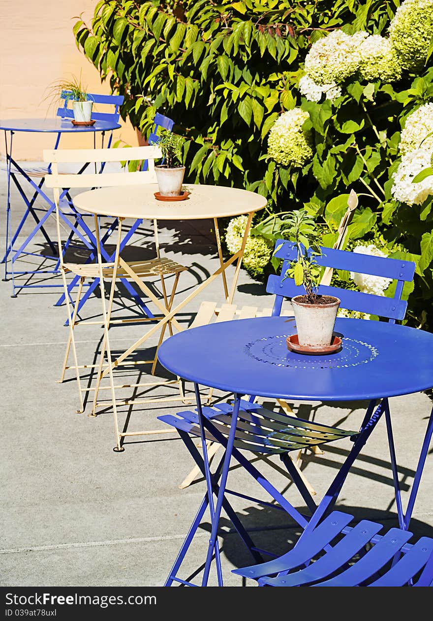 Blue and cream cafe tables outdoors