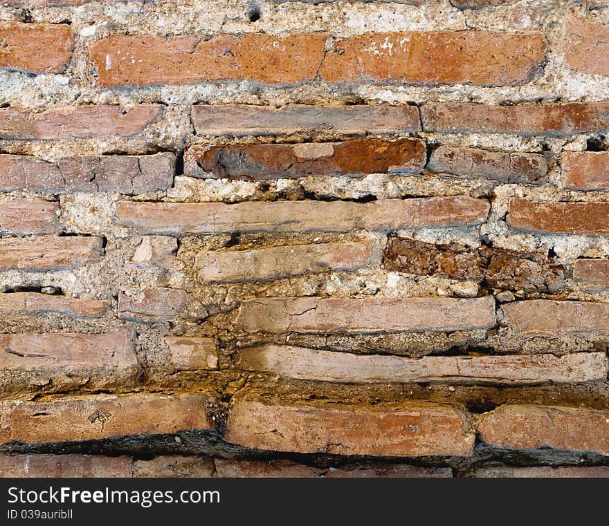 Ancient crumbling stone wall