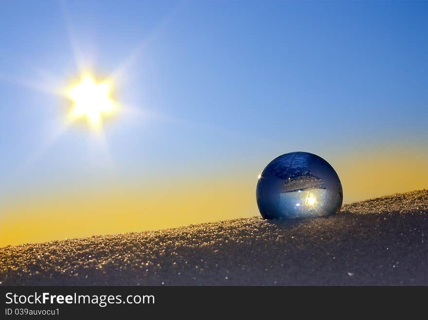 Glass globe in the snow.