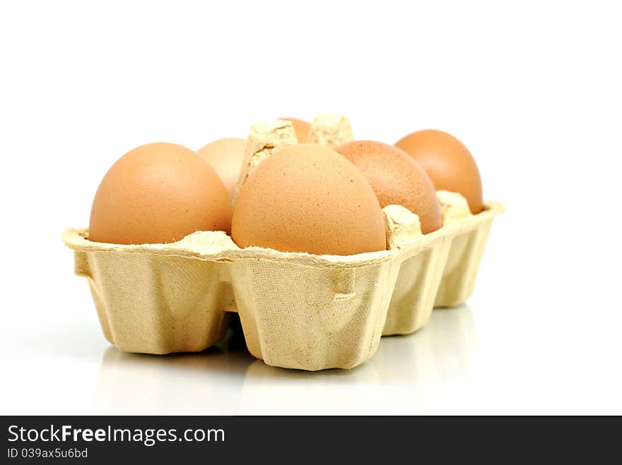 Eggs in box isolated on white background. Eggs in box isolated on white background.