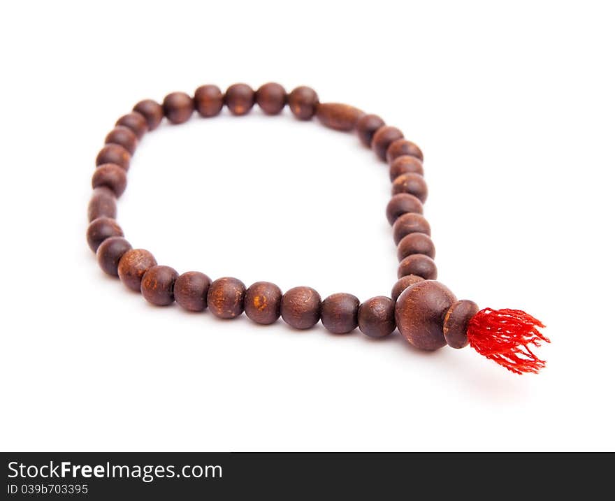 The image of wooden rosary isolated on white background