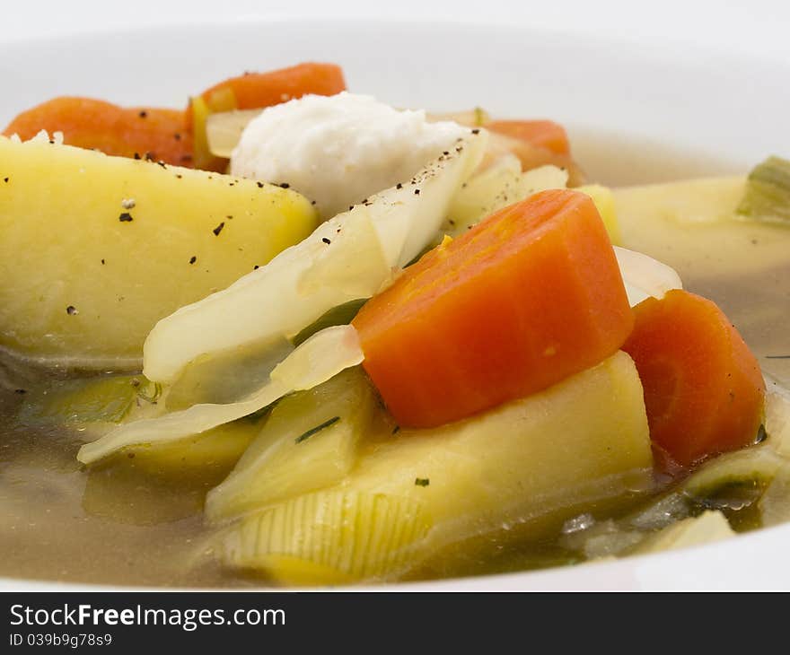 Carrots, potatoes and onions in a soup with horseradish. Carrots, potatoes and onions in a soup with horseradish