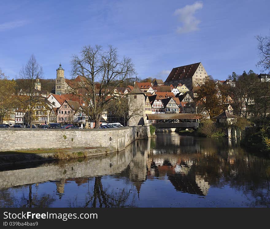 Panoramic view of the medieval town of Schwaebisch Hall in the Kocher valley in Germany. Except for the modern parking lot, the picture could have been taken some centuries ago.